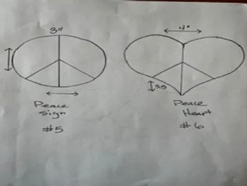 Hand-drawn comparison of peace sign and peace heart symbols with measurements.