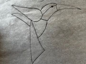 Simple pencil sketch of a hummingbird in flight.