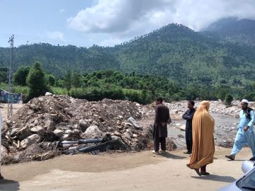 Community members passing through the devastated villages in Buner. Photo Credit -Sohail-FRD