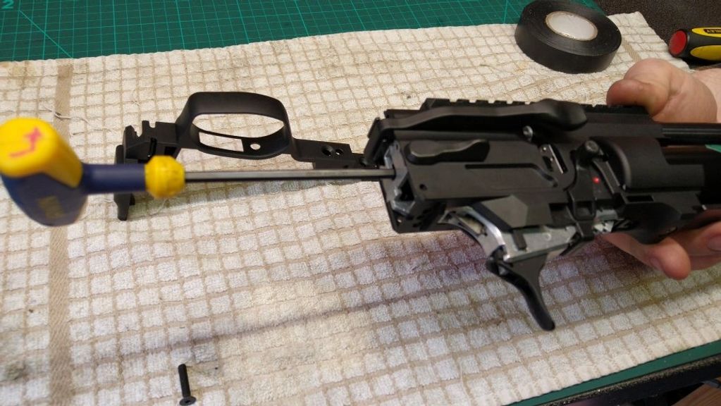 Using a 4mm allen key to adjust the hammer spring tension (power) on the Weihrauch HW110