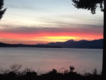 lake and bushes with mountains at sunset 2