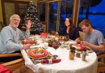 people eating in a restaurant with a Christmas tree