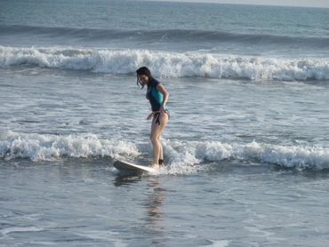 beach with surfboard and swimsuit