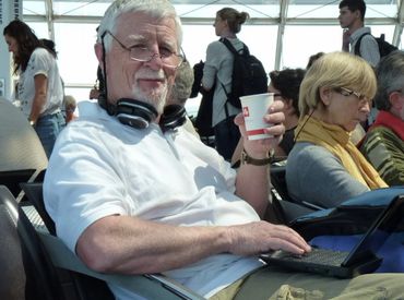 man with beard holding coffee cup