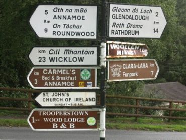 eight signs with bridge and trees