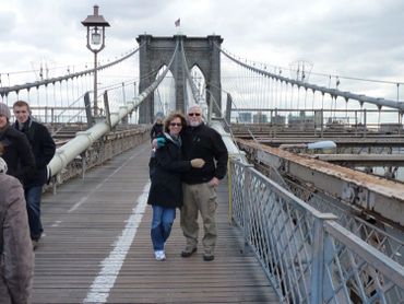 couple hugging on a bridge