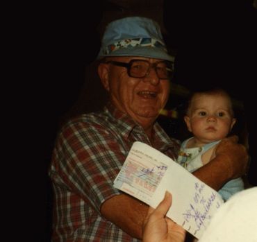 grandfather holding grandson