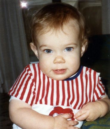 Gary wearing a red and white pinstriped shirt