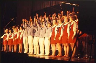 GLS members performing and raising their arms