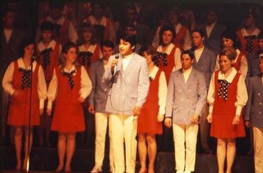 GLS members with soloist holding microphone