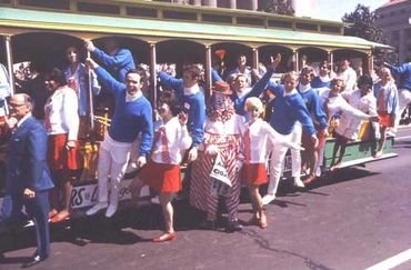 GLS members hanging off of a trolley car