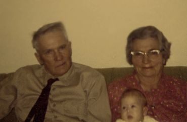 old photograph of parents and a child