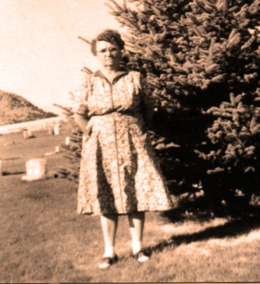 old photograph of woman in a floral dress