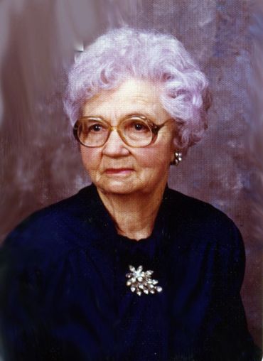 painting of grandmother in blue with brooch