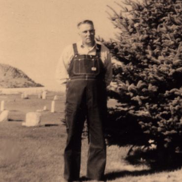 old photograph of man in overalls