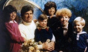 family photo with flowers and seat