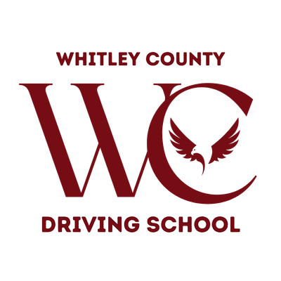 Whitley County Driving School logo with bold maroon letters and a winged emblem.