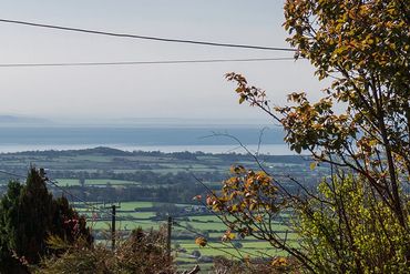 The stunning view from Arallt Holiday Cottage across Llithfaen towards Cardigan Bay and Pwllheli