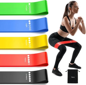 Woman exercising with resistance bands of different strengths.