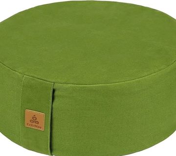 Green round cushion with a tag.