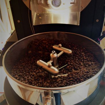 Freshly roasted coffee beans in a cooling drum