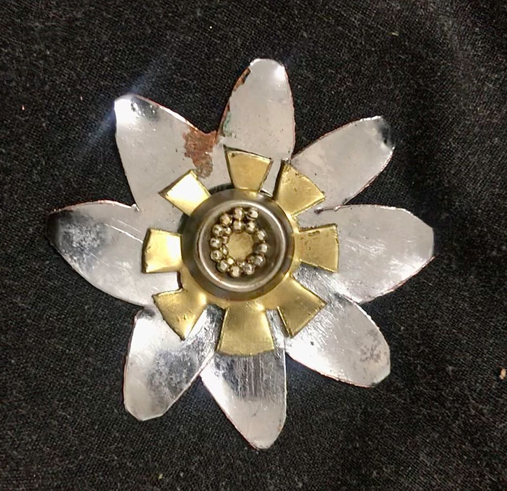 Handmade silver and brass artisan flower pendant cutout
