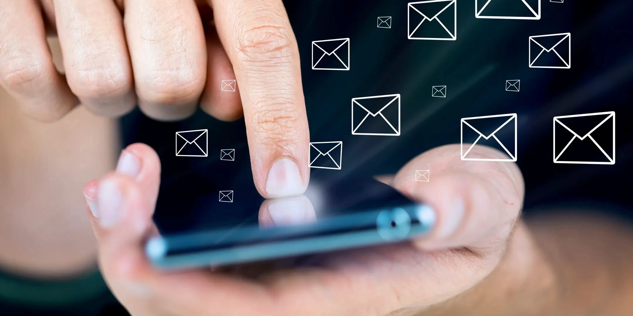 A Finger tapping a Phone Screen with images of envelopes in the background.