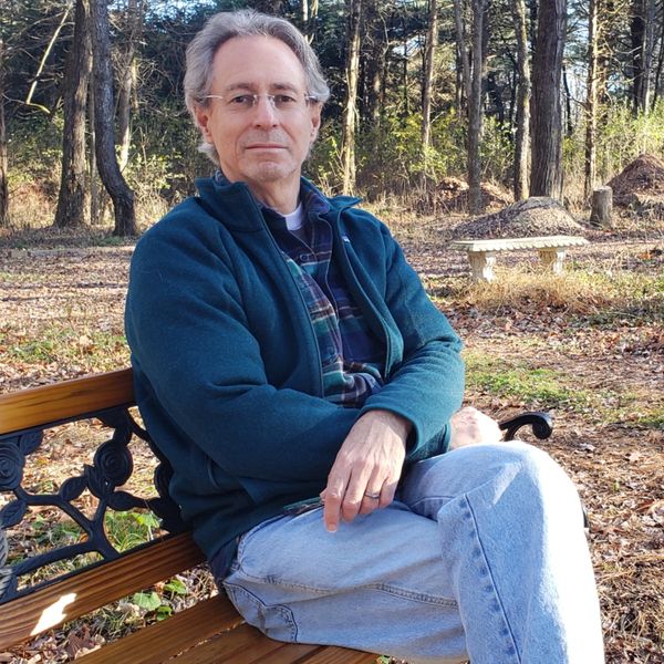 A man sitting on a bench