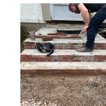 Man building brick steps