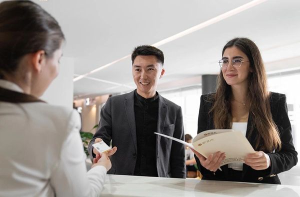 Experienced lawyer reviewing legal documents inside a modern office setting .
Receiving documents