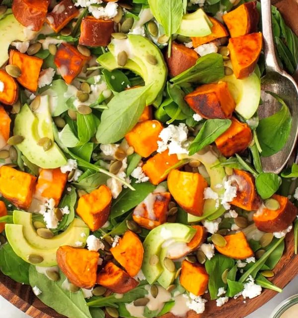 Spinach-salad-with-butternut-squash-avocado-pepitas-pickled-red-onion-tossed-with-creamy-cilantro-li