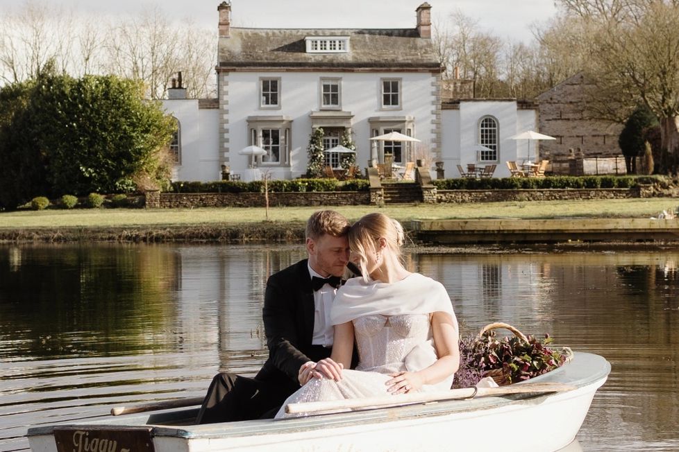 Holesfoot wedding florist, couple floating in a boat of florals, Lake District wedding florist