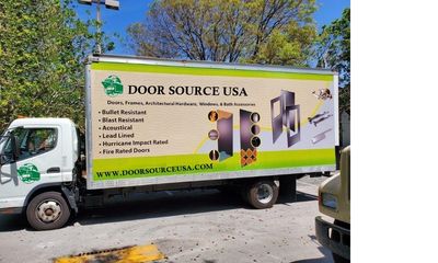 Truck with Door Source USA advertisement for security and architectural doors.