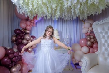 Portrait of happy girl princess in white dress