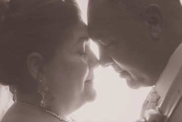 Close-up of beautiful emotional bride and handsome groom