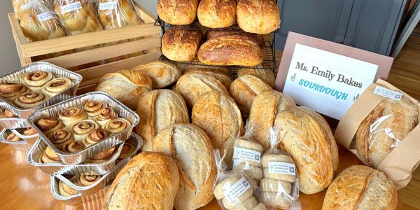 Display of sourdough breads and cinnamon rolls.