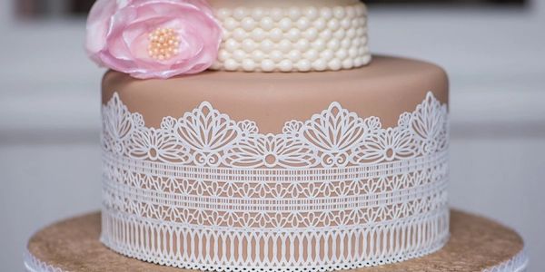 Fondant wedding cake with sugar lacework