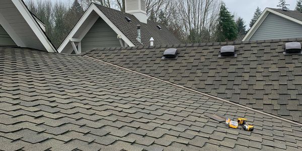 Close-up of a rooftop with tools lying on it.