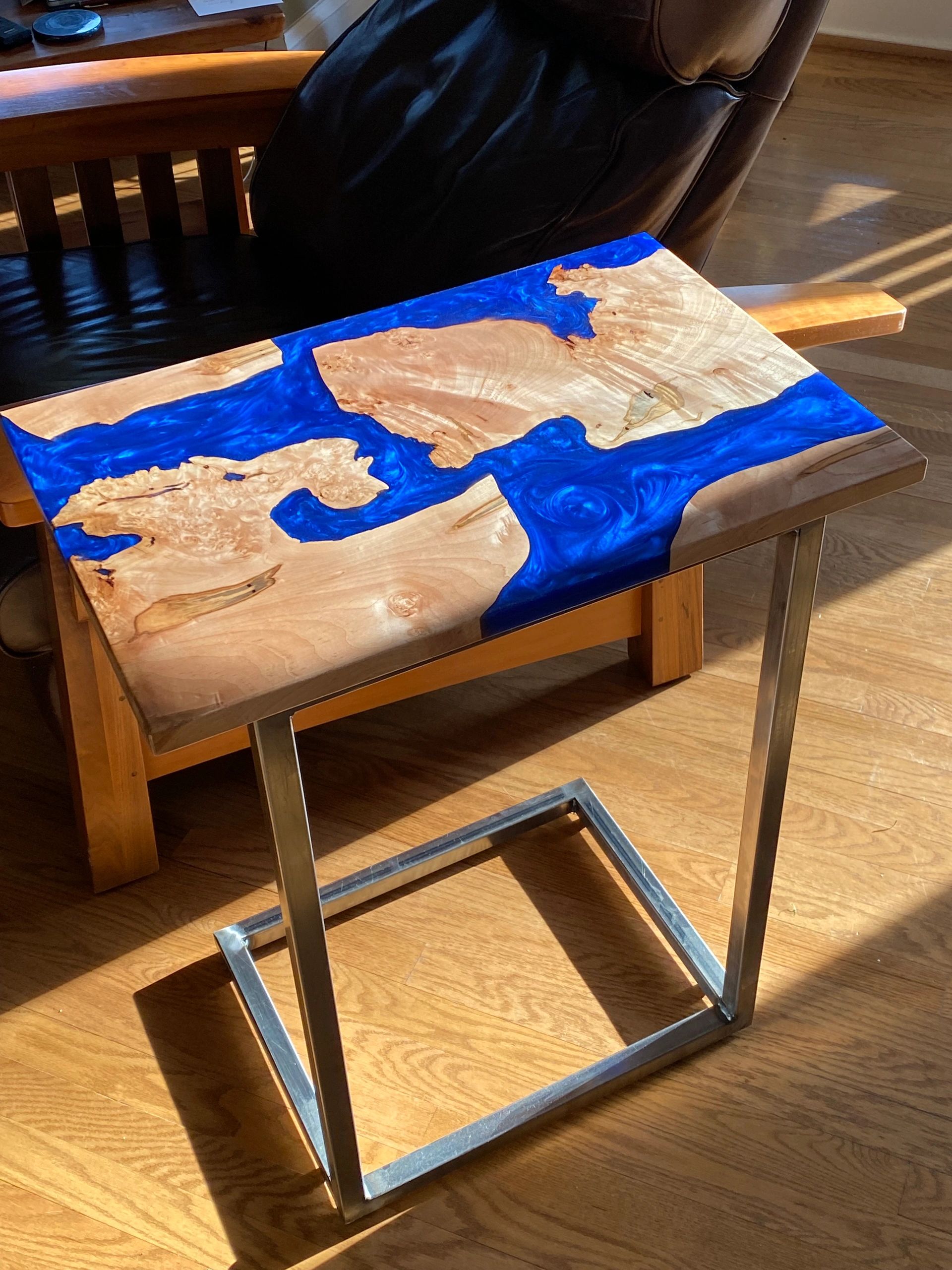 Ambrosia maple with blue resin C-table with steel base and leveling feet.
