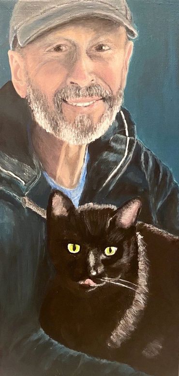 A man holding a black cat