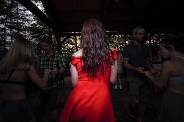 A wedding guest dancing.