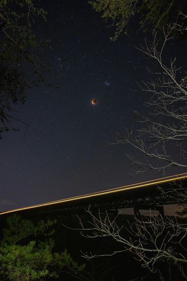 A lunar eclipse over the New River Gorge Bridge.