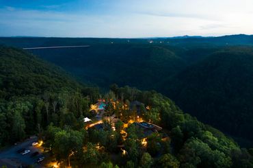 A drone photo of a wedding venue next to the New River Gorge.