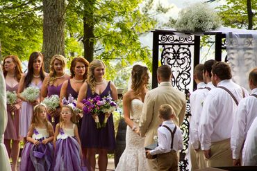 A wedding party in front of a beautiful vista.