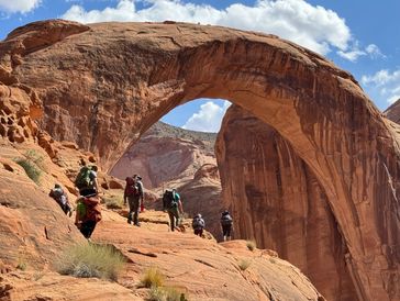 backpackers hiking near rainbow bridge national monument