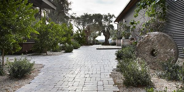 Scott Shrader Design using 4x10 Limestone Pavers with tumbled edges. Simply stunning!
