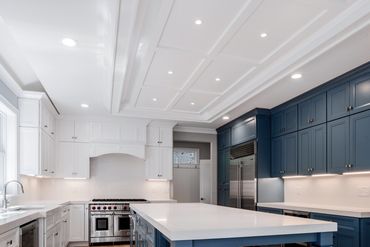 Clean kitchen, navy cabinets