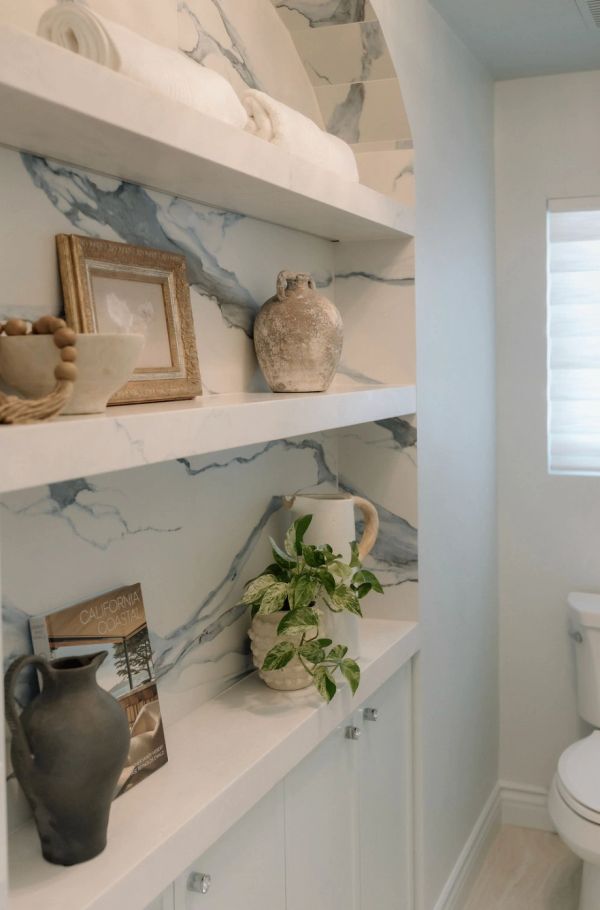 Toilet room arch with large blue veining tile