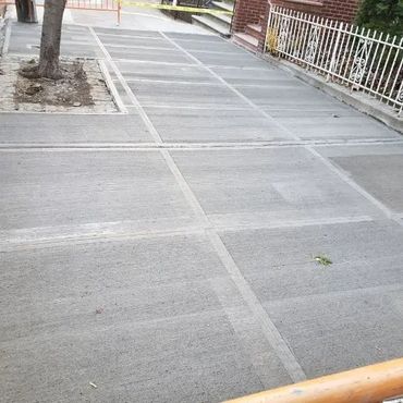 Professional sidewalk violation repair & removal services, by AQ Construction in the Bronx and NYC.