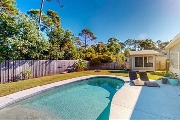 Panama City vacation home back yard with private pool, grill, lounge chairs